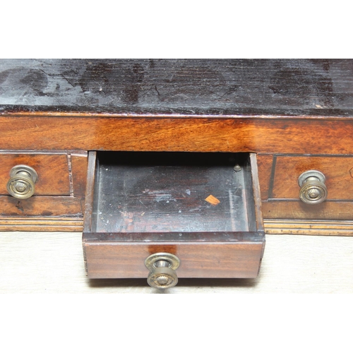 69 - A Georgian mahogany corner cupboard with a central drawer to bottom frieze flanked by two faux drawe... 