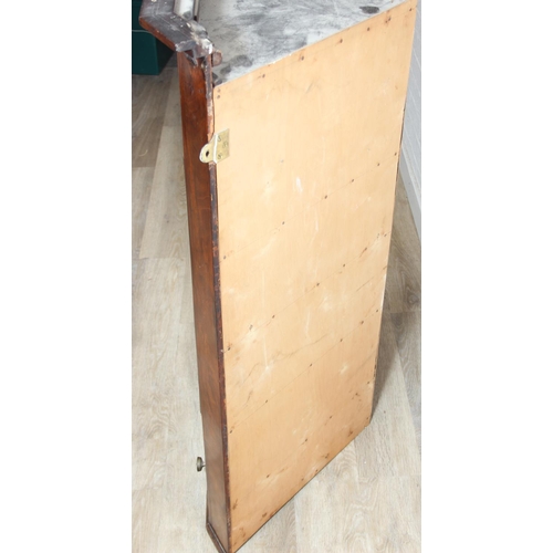 69 - A Georgian mahogany corner cupboard with a central drawer to bottom frieze flanked by two faux drawe... 