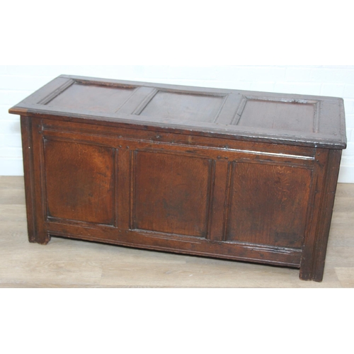 89 - An 18th century oak coffer with iron fittings and panelled design, 125cm x 53cm x 57cm