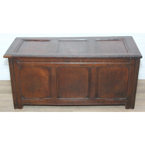 89 - An 18th century oak coffer with iron fittings and panelled design, 125cm x 53cm x 57cm