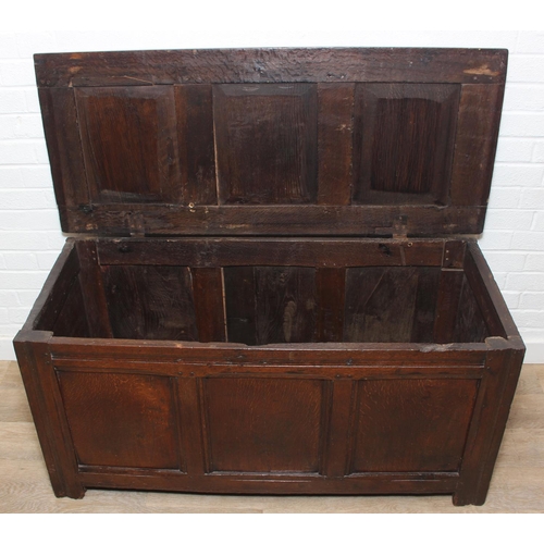 89 - An 18th century oak coffer with iron fittings and panelled design, 125cm x 53cm x 57cm