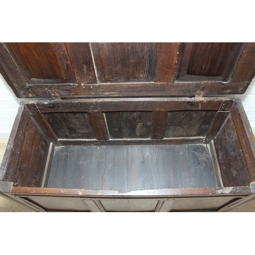 89 - An 18th century oak coffer with iron fittings and panelled design, 125cm x 53cm x 57cm