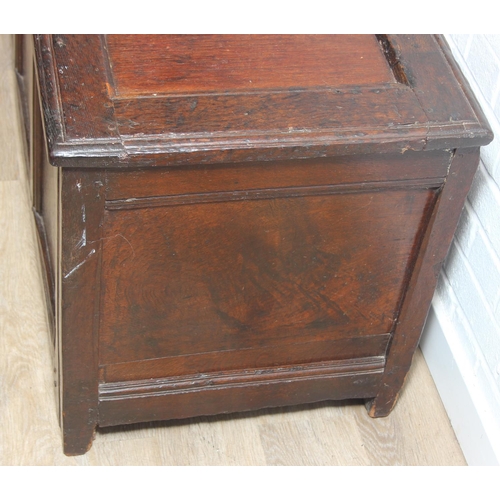 89 - An 18th century oak coffer with iron fittings and panelled design, 125cm x 53cm x 57cm