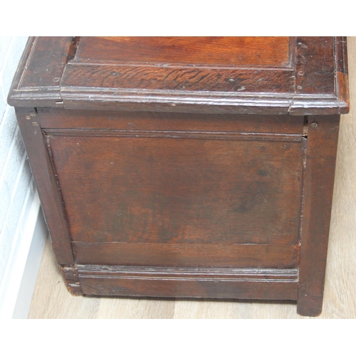 89 - An 18th century oak coffer with iron fittings and panelled design, 125cm x 53cm x 57cm