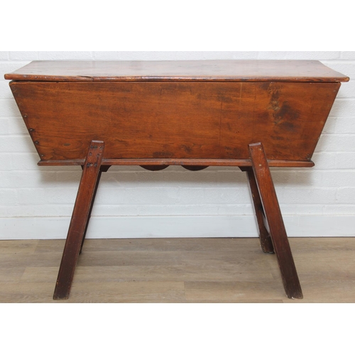 94 - An antique elm dough bin on wooden legs, likely 19th century, 106cm x 48cm x 75cm