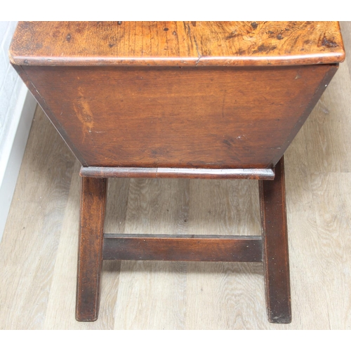 94 - An antique elm dough bin on wooden legs, likely 19th century, 106cm x 48cm x 75cm