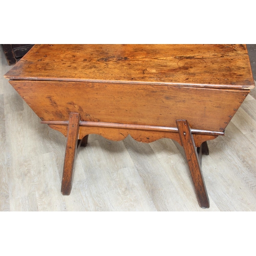 94 - An antique elm dough bin on wooden legs, likely 19th century, 106cm x 48cm x 75cm