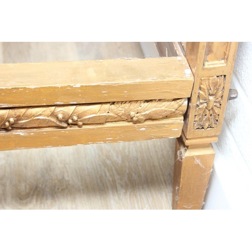 64 - A vintage single bed with gold painted carved wooden and bergère head and foot boards, side boards b... 