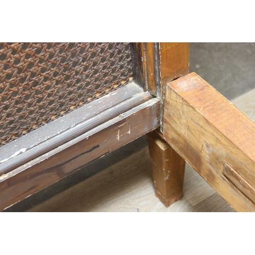 64 - A vintage single bed with gold painted carved wooden and bergère head and foot boards, side boards b... 