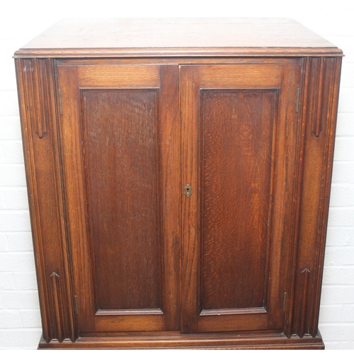 119 - Vintage oak tallboy compromising cupboard with two glass shelves over two drawers, 68cm x 44cm x 34c... 