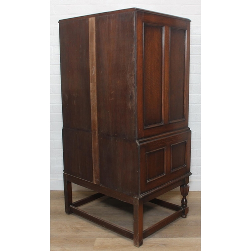 119 - Vintage oak tallboy compromising cupboard with two glass shelves over two drawers, 68cm x 44cm x 34c... 