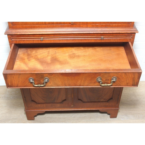 115 - Vintage mahogany cocktail cabinet with glass topped serving slide and drawer between two cupboards, ... 