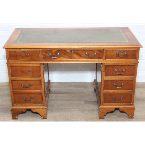 107 - A vintage Yew wood pedestal desk with inset green leather top, 120cm x 61cm x 77cm