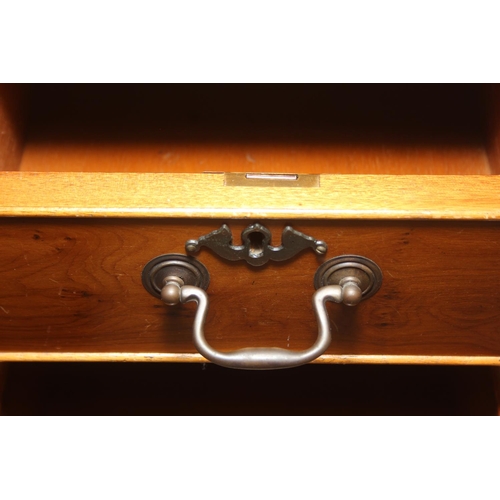 107 - A vintage Yew wood pedestal desk with inset green leather top, 120cm x 61cm x 77cm