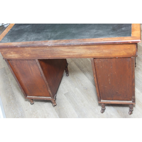 59 - An Edwardian three part desk with inset dark leather top and castors, brass fittings, 106cm x 55cm x... 