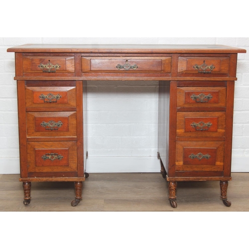 59 - An Edwardian three part desk with inset dark leather top and castors, brass fittings, 106cm x 55cm x... 
