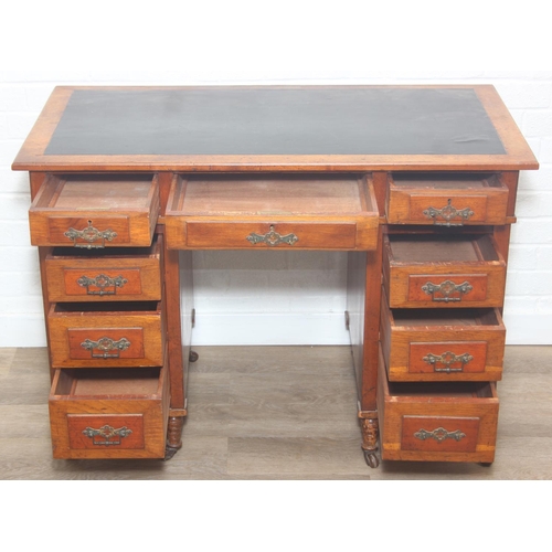 59 - An Edwardian three part desk with inset dark leather top and castors, brass fittings, 106cm x 55cm x... 