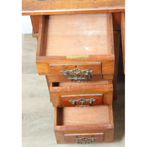 59 - An Edwardian three part desk with inset dark leather top and castors, brass fittings, 106cm x 55cm x... 
