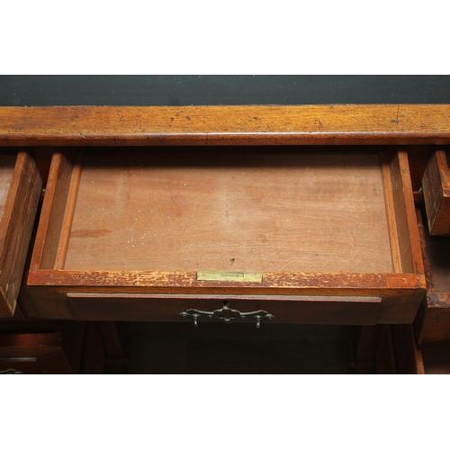 59 - An Edwardian three part desk with inset dark leather top and castors, brass fittings, 106cm x 55cm x... 