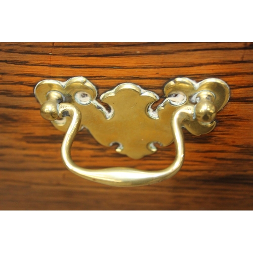 62 - A Georgian style oak sideboard with three deep drawers and brass curtained rail, early 20th century,... 