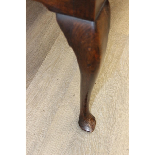62 - A Georgian style oak sideboard with three deep drawers and brass curtained rail, early 20th century,... 