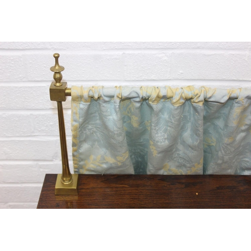 62 - A Georgian style oak sideboard with three deep drawers and brass curtained rail, early 20th century,... 