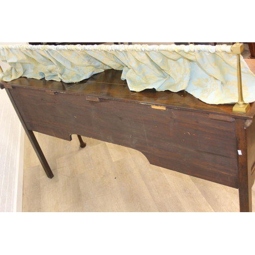 62 - A Georgian style oak sideboard with three deep drawers and brass curtained rail, early 20th century,... 