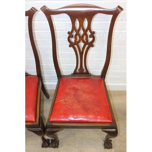 104 - Set of four antique Chippendale style chairs with red leather upholstery and decorative carved backs... 
