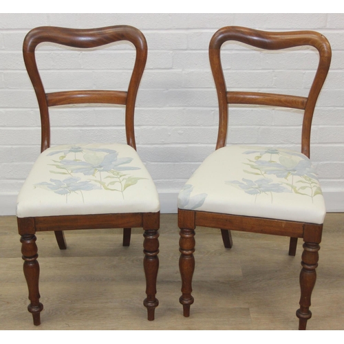 81 - A pair of Victorian mahogany side or bedroom chairs with later floral upholstery, each 82cm tall and... 