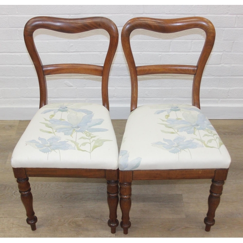 81 - A pair of Victorian mahogany side or bedroom chairs with later floral upholstery, each 82cm tall and... 