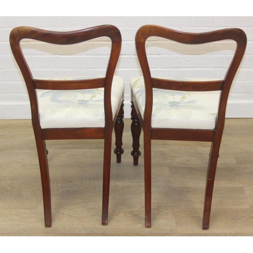 81 - A pair of Victorian mahogany side or bedroom chairs with later floral upholstery, each 82cm tall and... 