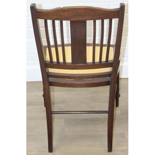 81 - A pair of Victorian mahogany side or bedroom chairs with later floral upholstery, each 82cm tall and... 