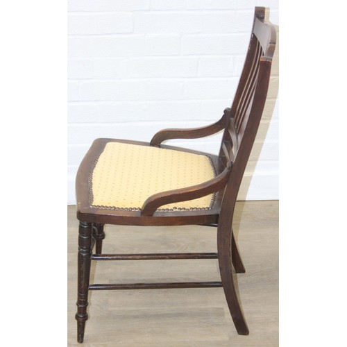 81 - A pair of Victorian mahogany side or bedroom chairs with later floral upholstery, each 82cm tall and... 