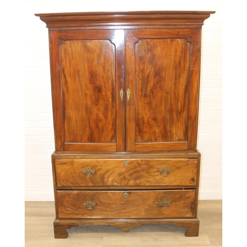 71 - A 19th century mahogany linen press with two drawers to base and converted single shelf to interior ... 