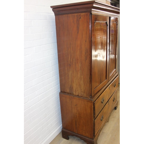71 - A 19th century mahogany linen press with two drawers to base and converted single shelf to interior ... 