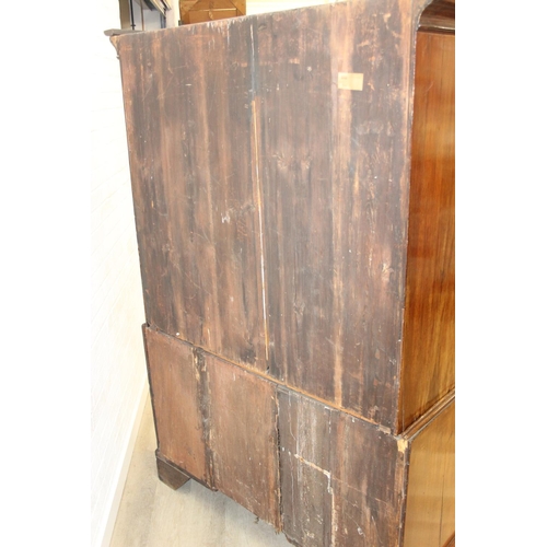 71 - A 19th century mahogany linen press with two drawers to base and converted single shelf to interior ... 