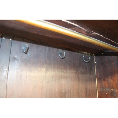 71 - A 19th century mahogany linen press with two drawers to base and converted single shelf to interior ... 