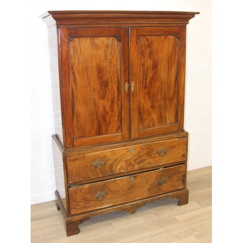 71 - A 19th century mahogany linen press with two drawers to base and converted single shelf to interior ... 