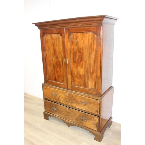 71 - A 19th century mahogany linen press with two drawers to base and converted single shelf to interior ... 