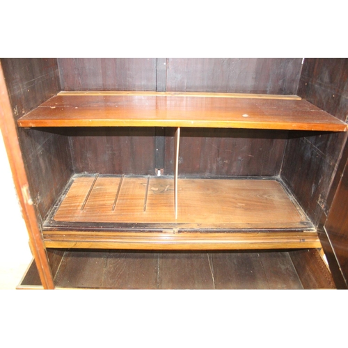71 - A 19th century mahogany linen press with two drawers to base and converted single shelf to interior ... 