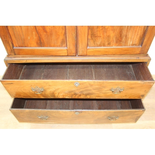 71 - A 19th century mahogany linen press with two drawers to base and converted single shelf to interior ... 