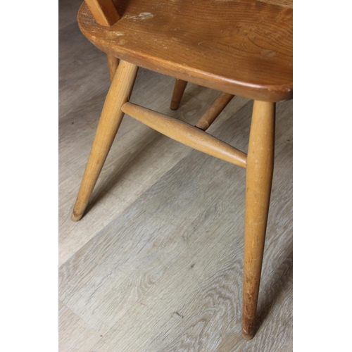 1 - A set of four Ercol hoop back dining chairs, blonde finish, each 85cm tall [4]