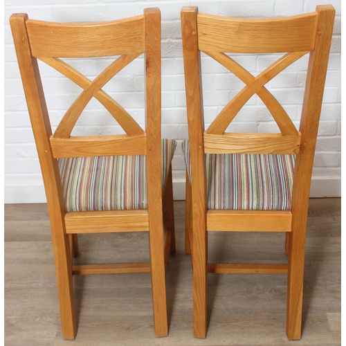 37 - Set of six modern oak dining chairs with arched X form design to back and multi-coloured fabric upho... 
