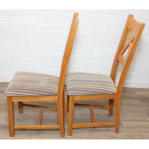 37 - Set of six modern oak dining chairs with arched X form design to back and multi-coloured fabric upho... 