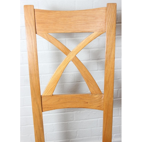 37 - Set of six modern oak dining chairs with arched X form design to back and multi-coloured fabric upho... 