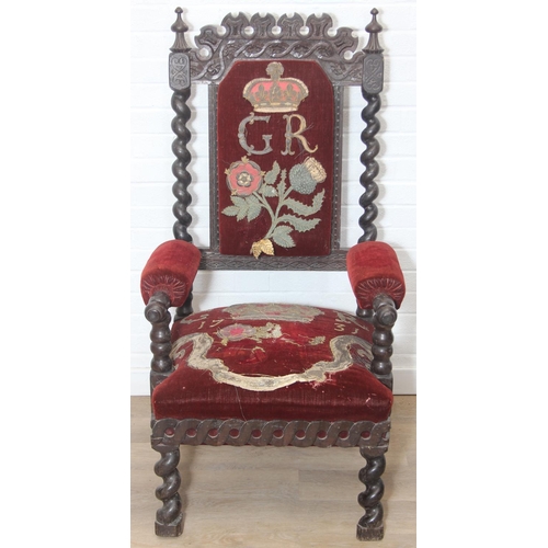 38 - An unusual antique carved oak throne chair with 1731 King George II related embroidery, the chair be... 