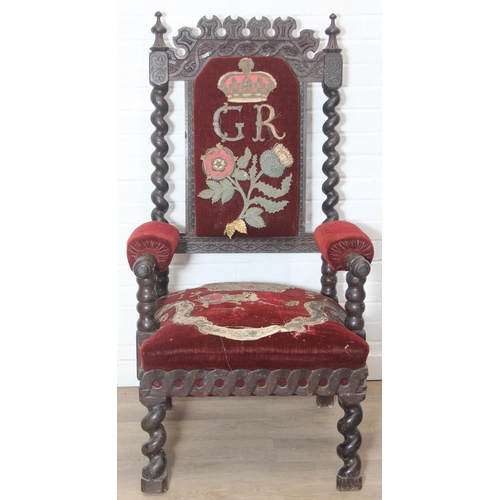 38 - An unusual antique carved oak throne chair with 1731 King George II related embroidery, the chair be... 