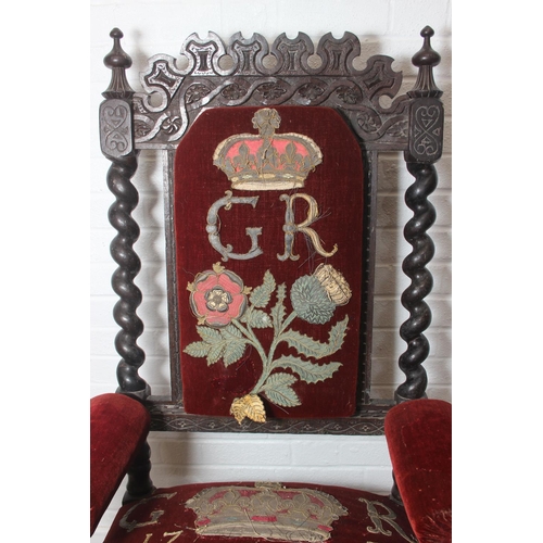 38 - An unusual antique carved oak throne chair with 1731 King George II related embroidery, the chair be... 