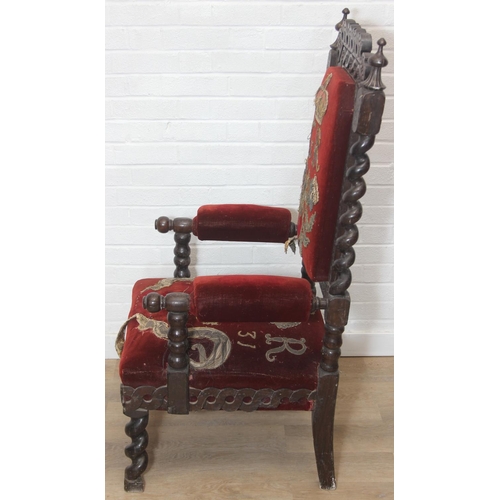 38 - An unusual antique carved oak throne chair with 1731 King George II related embroidery, the chair be... 