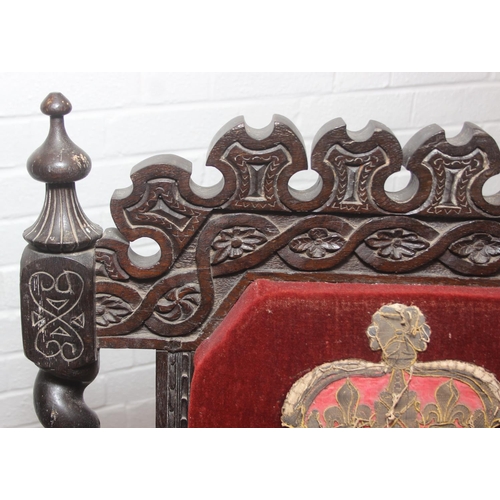 38 - An unusual antique carved oak throne chair with 1731 King George II related embroidery, the chair be... 